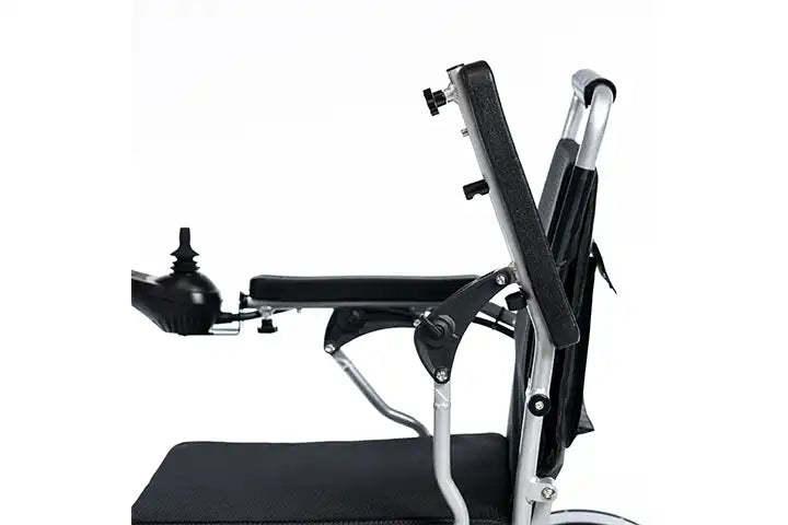 A close-up side view of a wheelchair with a black padded seat and backrest, silver metal frame, and a black armrest cup holder, isolated on a white background.